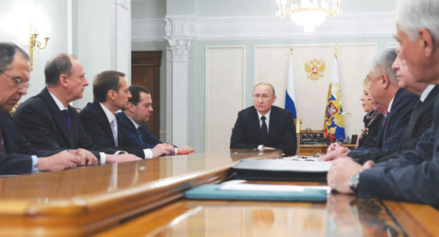 بوتين أثناء ترؤسه اجتماعا لمجلس الأمن القومي الروسي في موسكو أمس (رويترز)