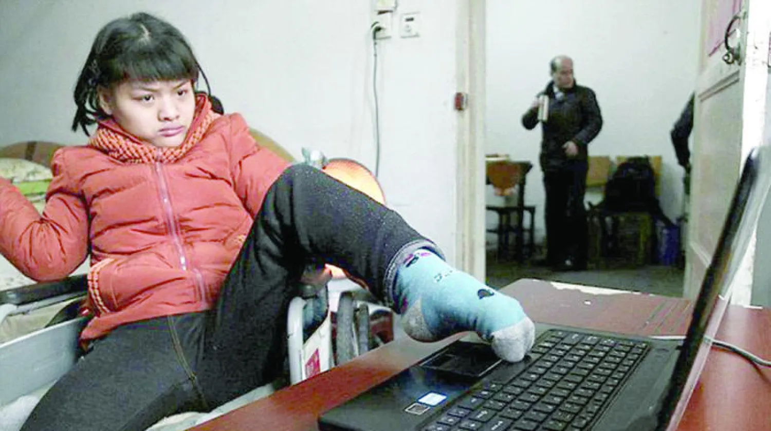 الفتاة الصينية هو هويان التي تحدت إعاقتها