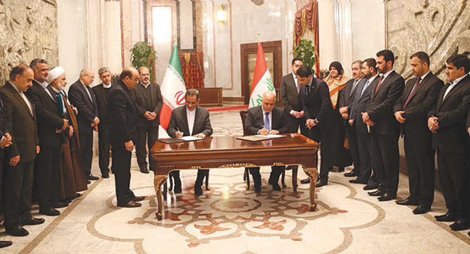 صورة من موقع رئاسة الوزراء العراقية لرئيس الحكومة حيدر العبادي ونائب الرئيس الإيراني إسحاق جهانغيري أثناء توقيعهما اتفاقات ومذكرات تفاهم في بغداد أمس