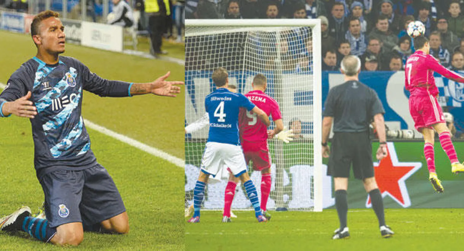 رونالدو نجم ريـال مدريد (يمين) يقفز ليسدد برأسه محرزا أول أهداف فريقه في مرمى شالكه (إ.ب.أ)  -  دانيلو نجم بورتو يحتفل بهدفه الذي منح فريقه التعادل (إ.ب.أ)