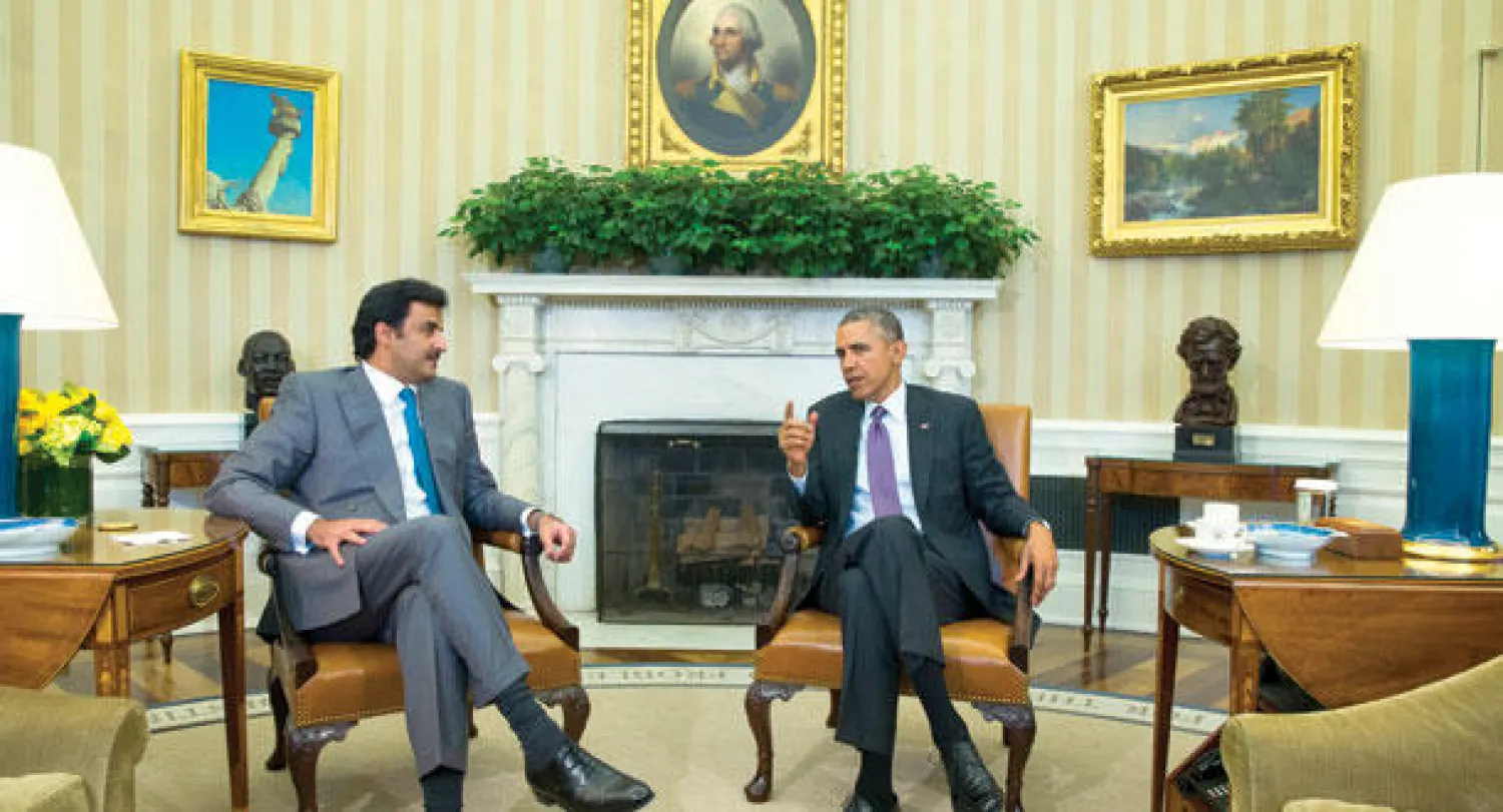 الرئيس الأميركي خلال استقباله أمير قطر في البيت الأبيض أمس (أ.ب)