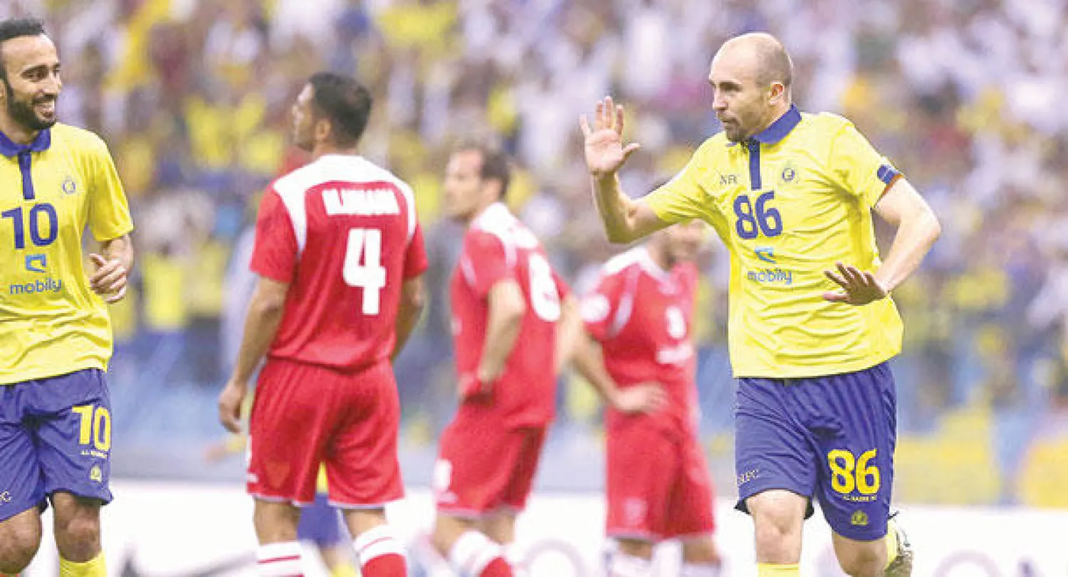 البولندي أدريان لاعب النصر يحتفل بهدفه في مرمى بيروزي الإيراني (تصوير: علي العريفي)