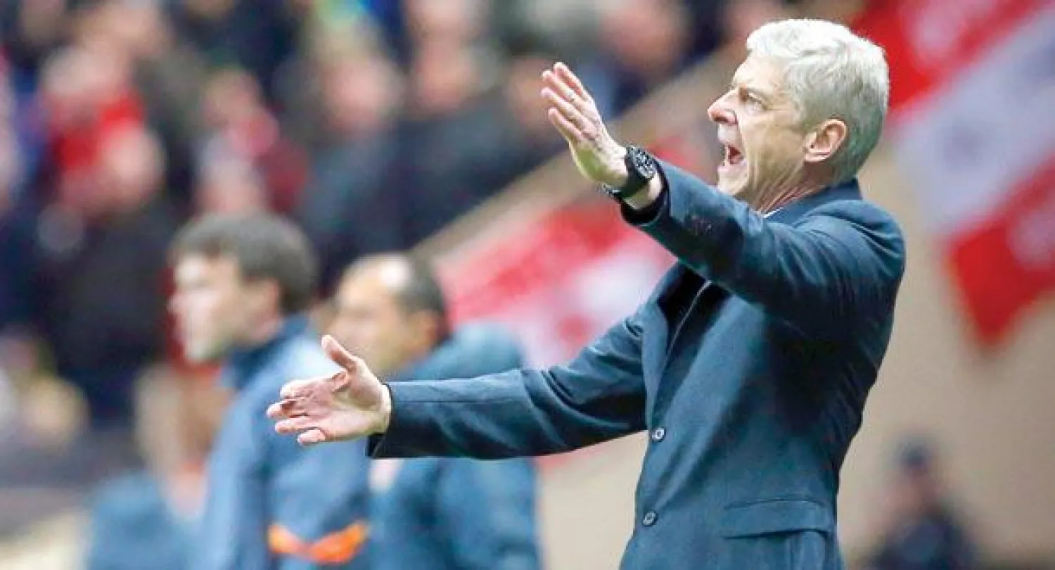 فينغر غاضب لخروج آرسنال من دوري الأبطال (إ.ب.أ)