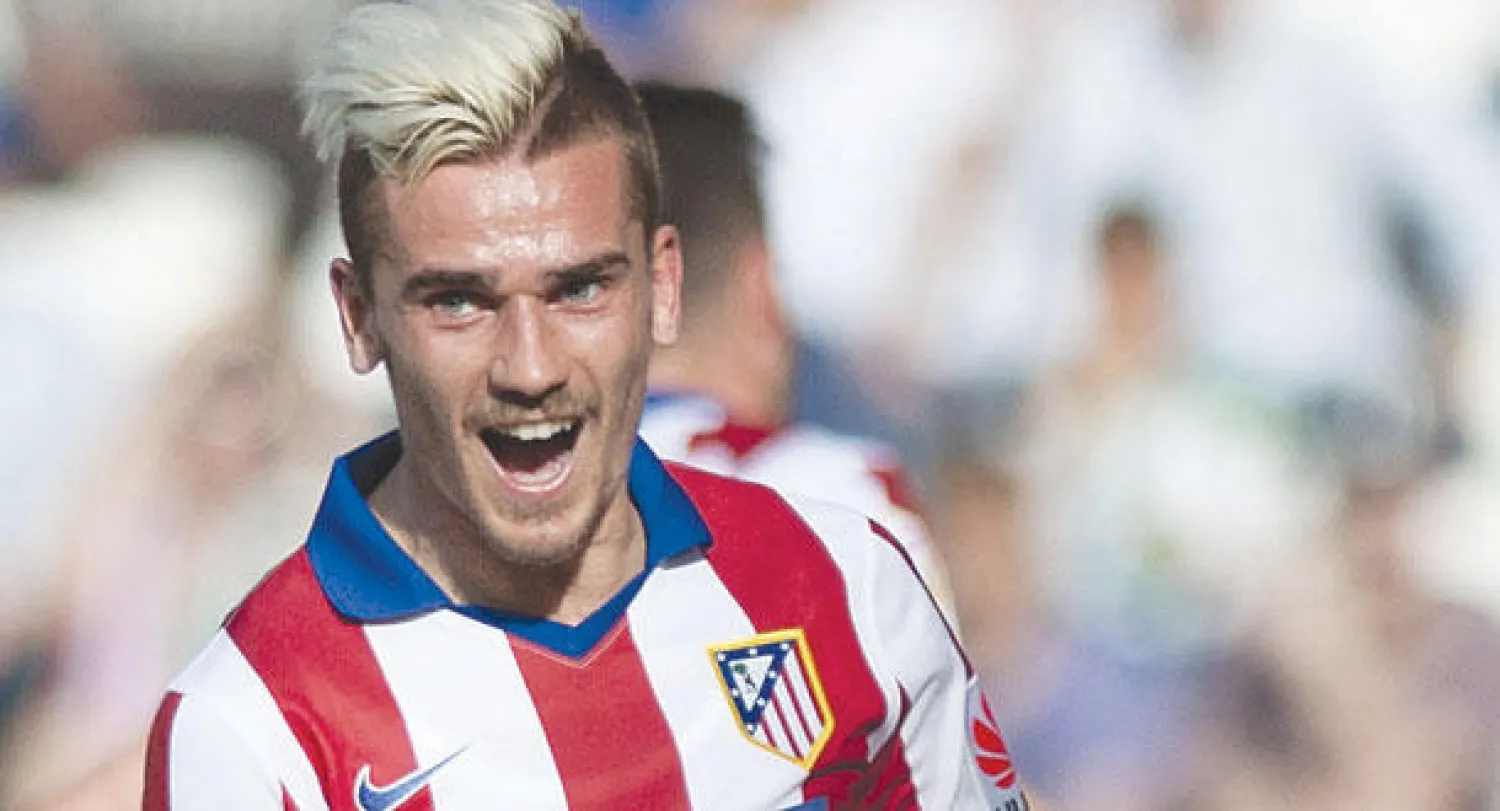 غريزمان سطع نجمه مع أتليتكو مدريد (أ.ف.ب)