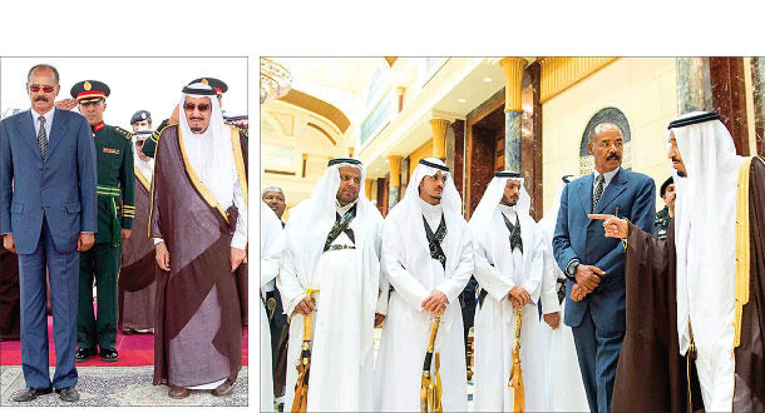 خادم الحرمين الشريفين الملك سلمان بن عبد العزيز يرحب برئيس إريتريا (واس) و خادم الحرمين الشريفين لدى استقباله الرئيس الإريتري في الرياض أول من أمس (واس)