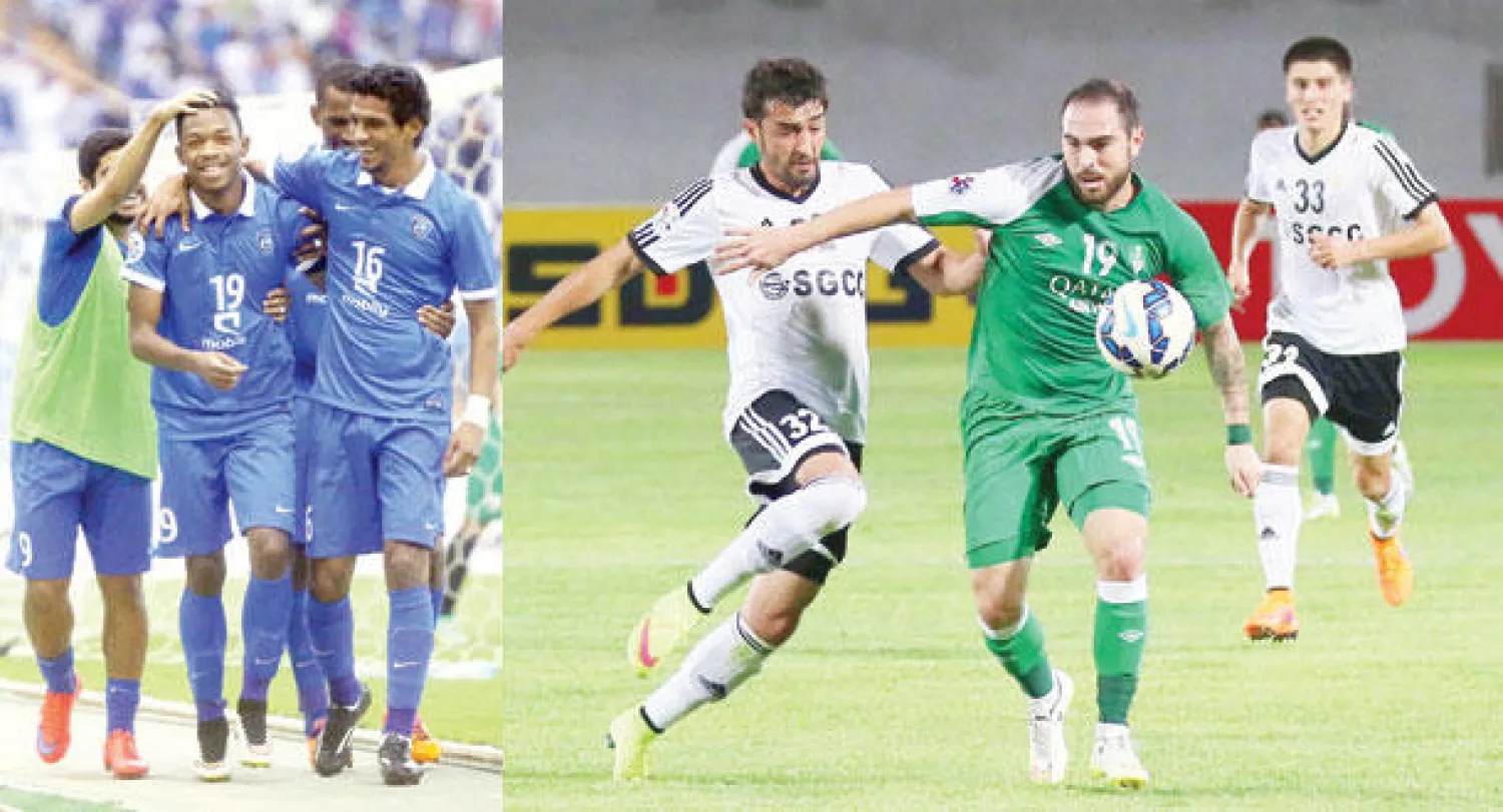 الأهلي حرم ناساف الأوزبكي من التأهل (المركز الإعلامي للنادي الأهلي)  -  فرحة هلالية في شباك السد القطري أمس (تصوير: مشعل القدير)