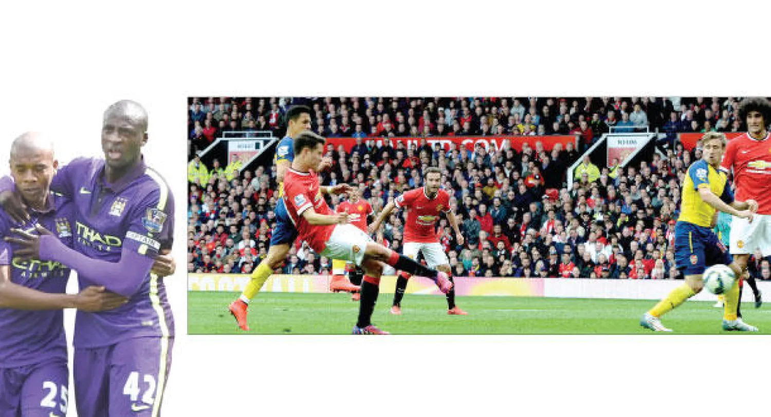 هيريرا لاعب يونايتد يصوب نحو مرمى آرسنال محرزا هدف التقدم لفريقه (إ.ب.أ)، توريه نجم  سيتي (يمين) يحتفل بهدفيه مع زميله فيرناندينهو (رويترز)