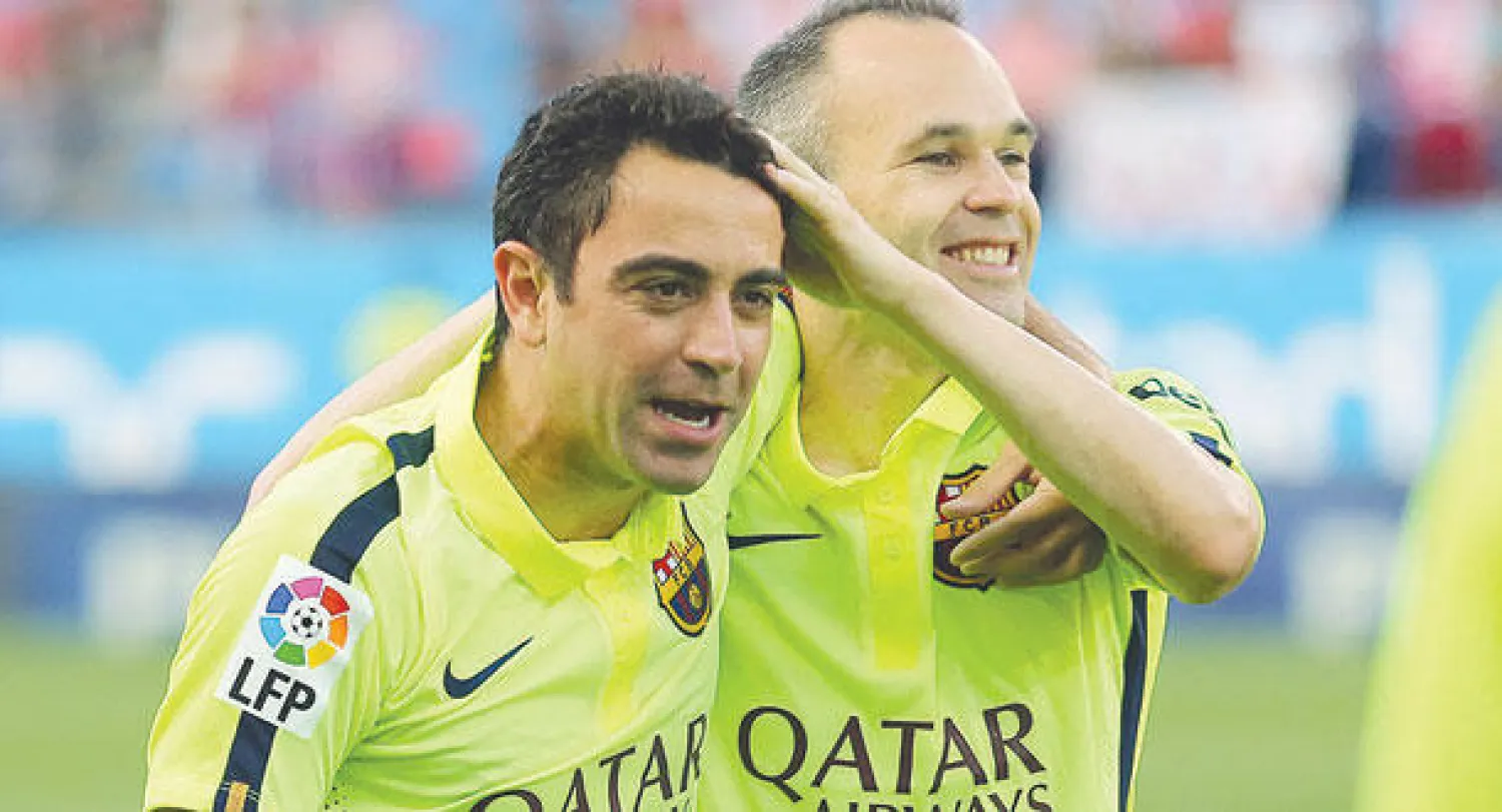 إنييستا وتشافي عنصرا الخبرة في برشلونة (أ.ف.ب)