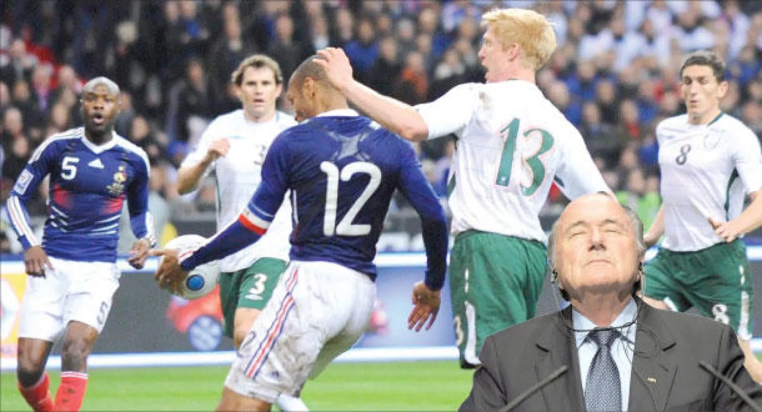 مسلسل فضائح بلاتر يتواصل (أ.ب)، و لمسة يد هنري (12) التي كلفت الفيفا 5 ملايين يورو («الشرق الأوسط»)