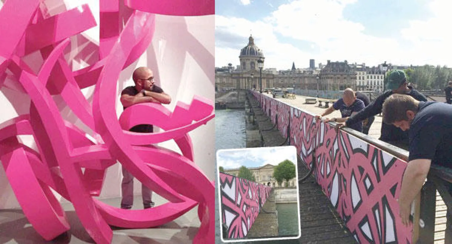 عمل السيد على سور جسر «بون ديزار» في باريس (الصورة: من السيد)  -  الفنان مع أحد أعماله في الشارقة