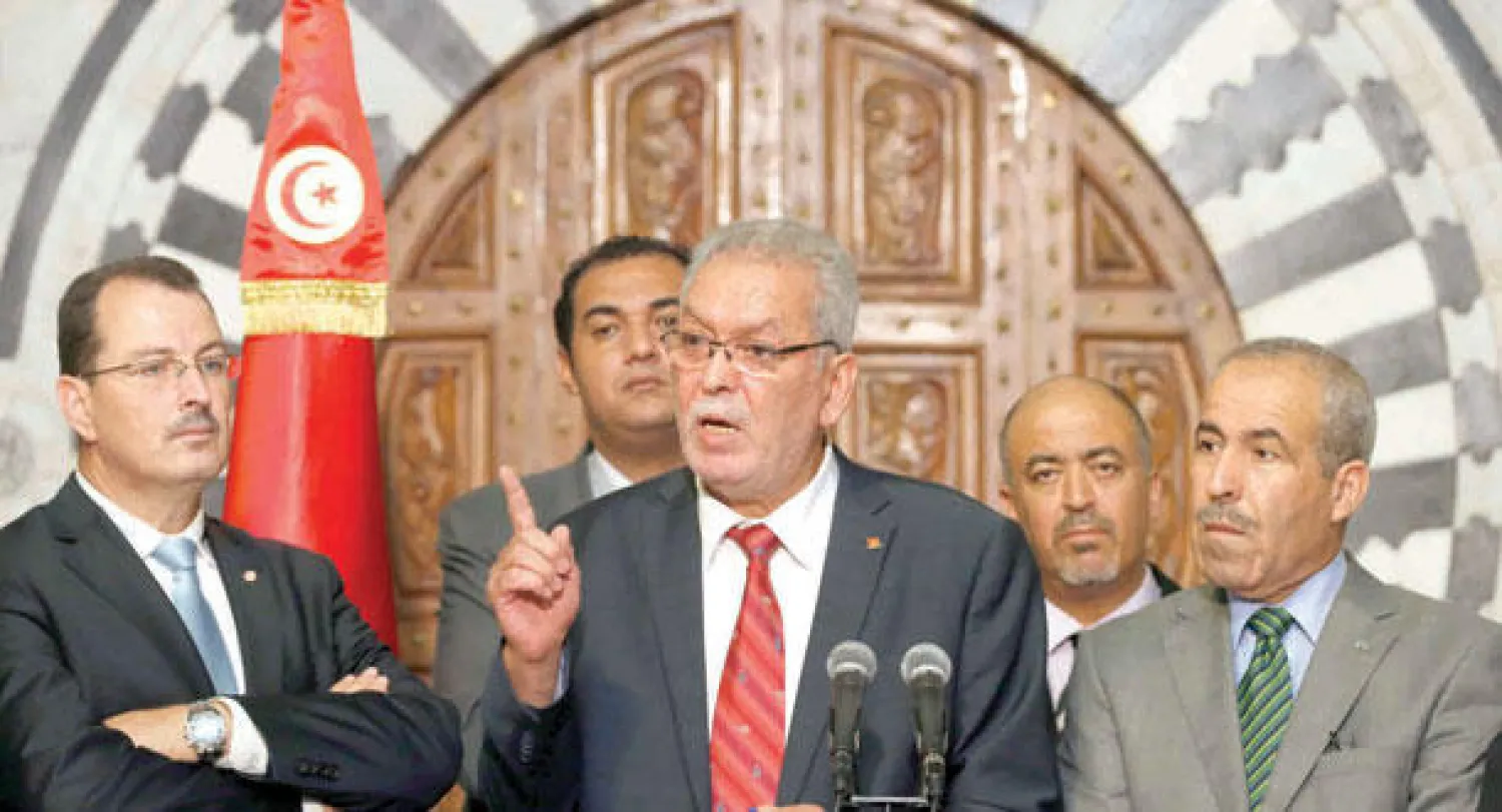 كمال الجندوبي وزير الدولة المكلف العلاقات مع الهيئات الدستورية والمجتمع المدني في تونس يتحدث في المؤتمر الصحافي الذي عقده بالعاصمة أمس (أ.ب)