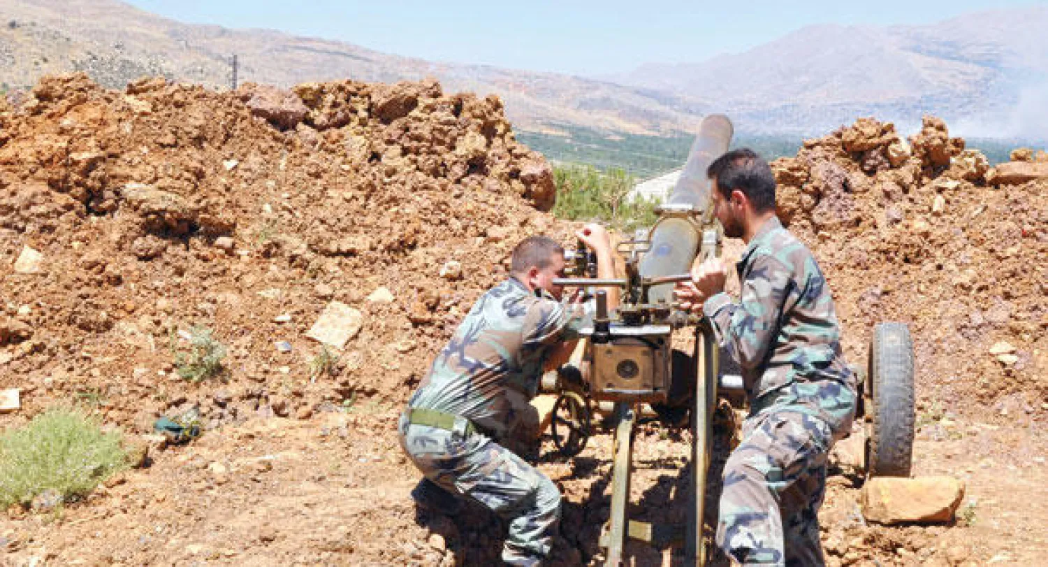 موقع لجيش النظام السوري على جبهة الزبداني في ريف دمشق يقصف تجمعات  فصائل المعارضة (إ.ب.أ)