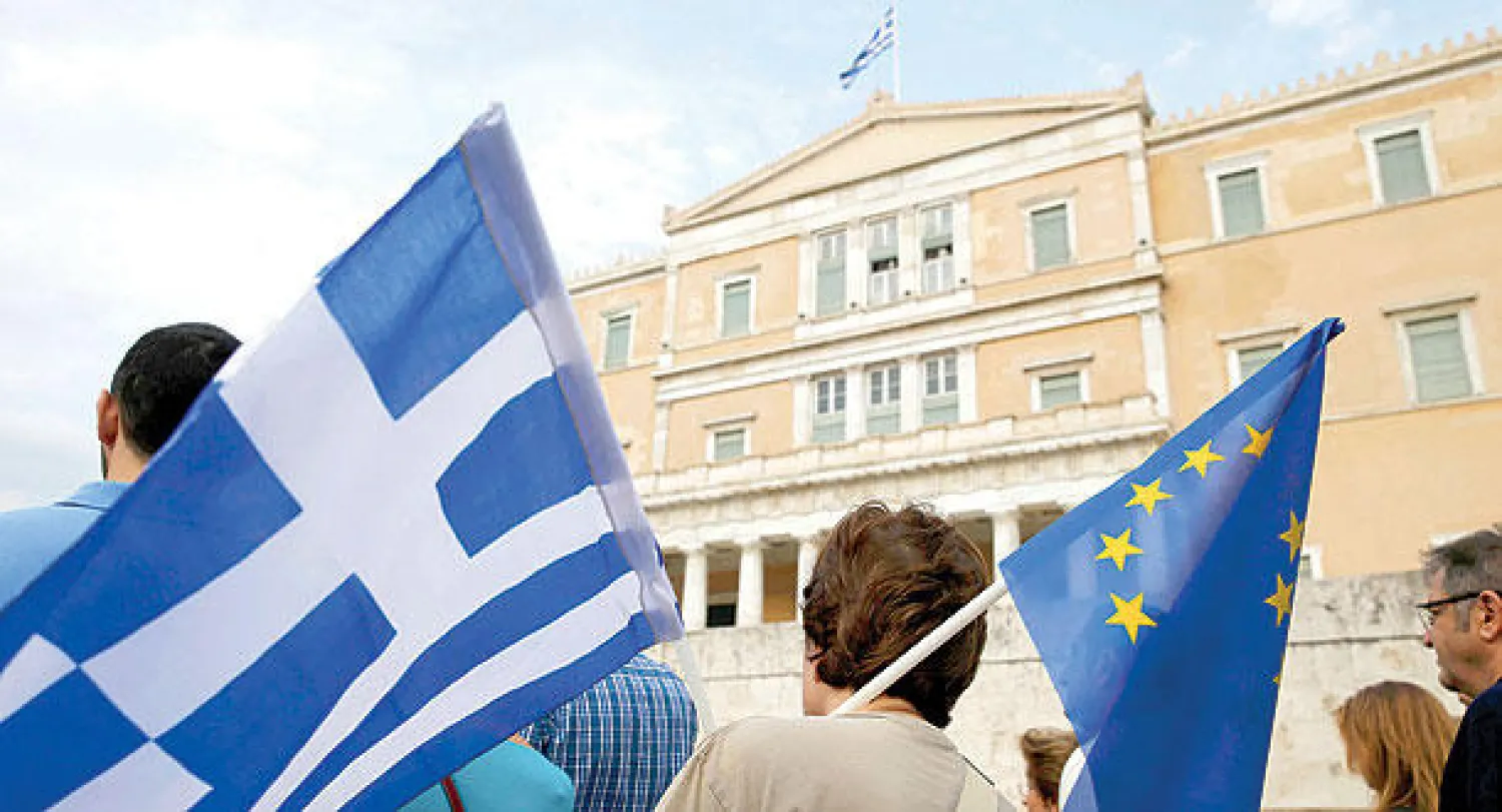 البرلمان اليوناني يصوت بأغلبية لصالح خطة التقشف.. وتصدع في الحزب الحاكم