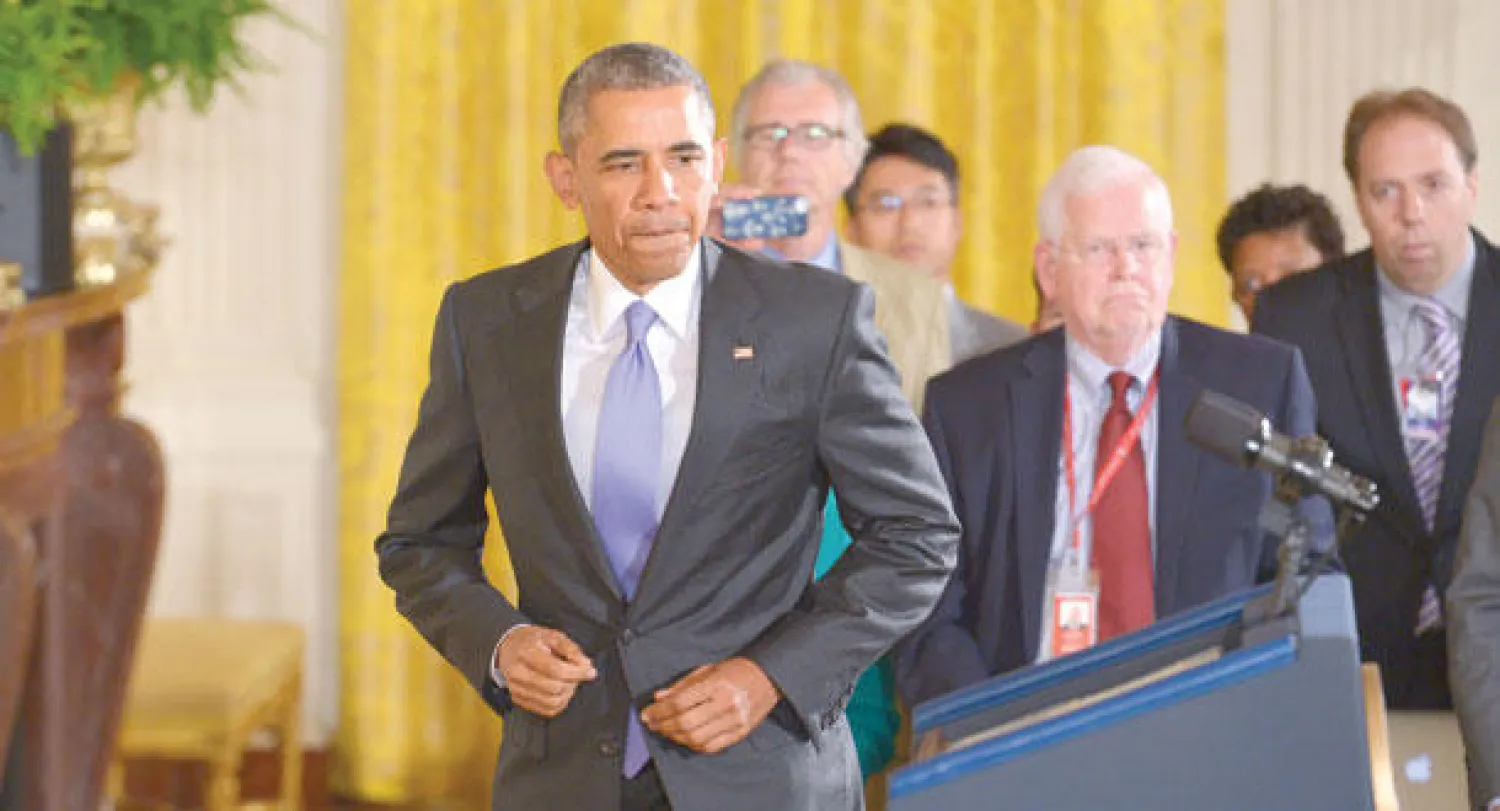 اوباما قبيل مؤتمره الصحافي في البيت الابيض امس (أ.ف.ب)