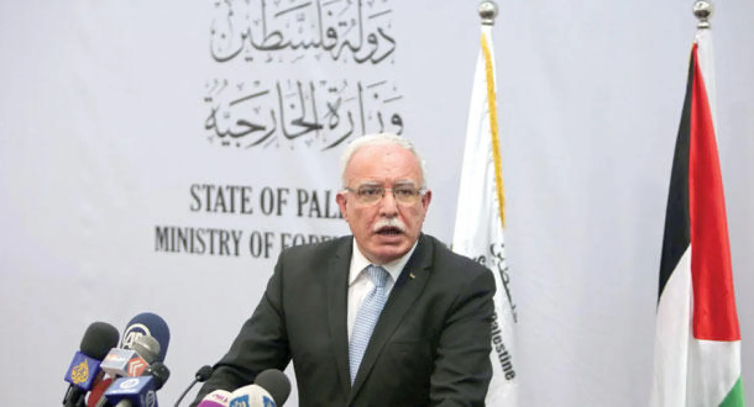 وزير الخارجية الفلسطيني رياض المالكي خلال مؤتمره الصحافي في رام الله بالضفة الغربية (أ.ف.ب)