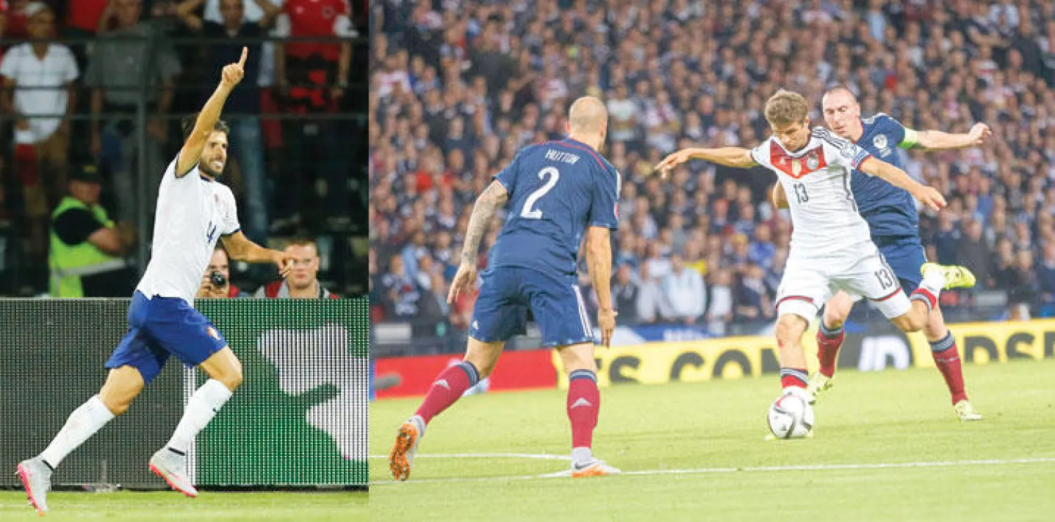 مولر نجم ألمانيا المتألق (في الوسط) يسدد نحو مرمى اسكوتلندا (إ.ب.أ)  -  فيلوزو يحتفل بهدفه الذي منح البرتغال الفوز على ألبانيا (إ.ب.أ)