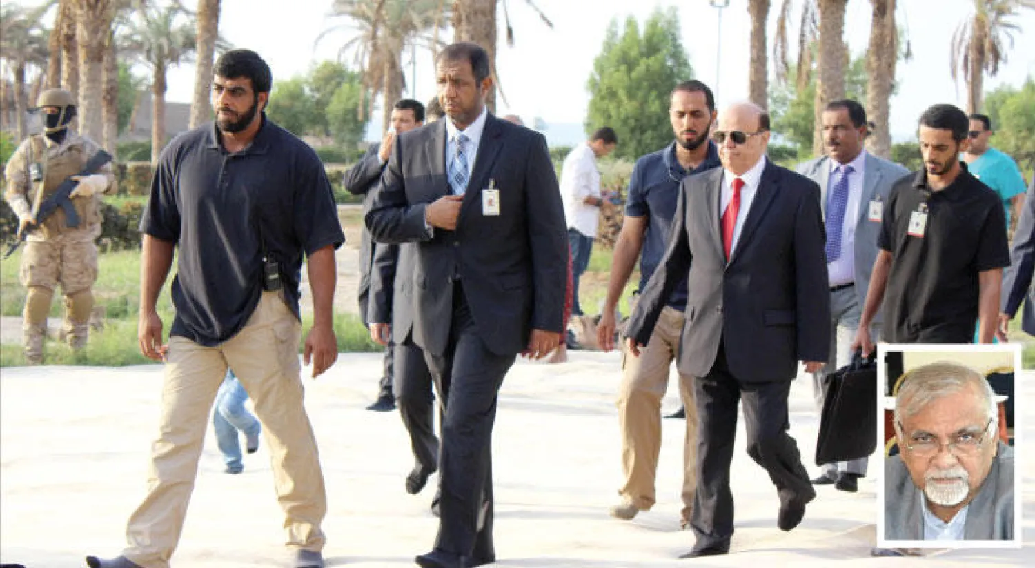 ياسين مكاوي (في الاطار)، و الرئيس عبد ربه منصور هادي في عدن أول من أمس (ا ف ب)