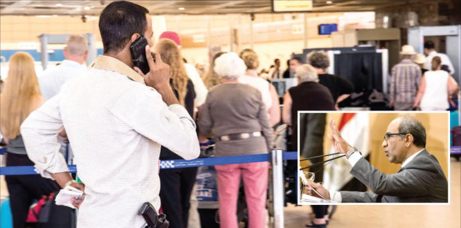 عنصر من رجال الأمن المصريين يتحدث في الجوال خلال مغادرة مجموعة من السائحين مطار شرم الشيخ أمس (أ.ب) وفي الإطار كابتن أيمن المقدم رئيس لجنة التحقيق في أسباب سقوط الطائرة الروسية يتحدث في المؤتمر الصحافي في القاهرة أمس (إ.ب.أ)