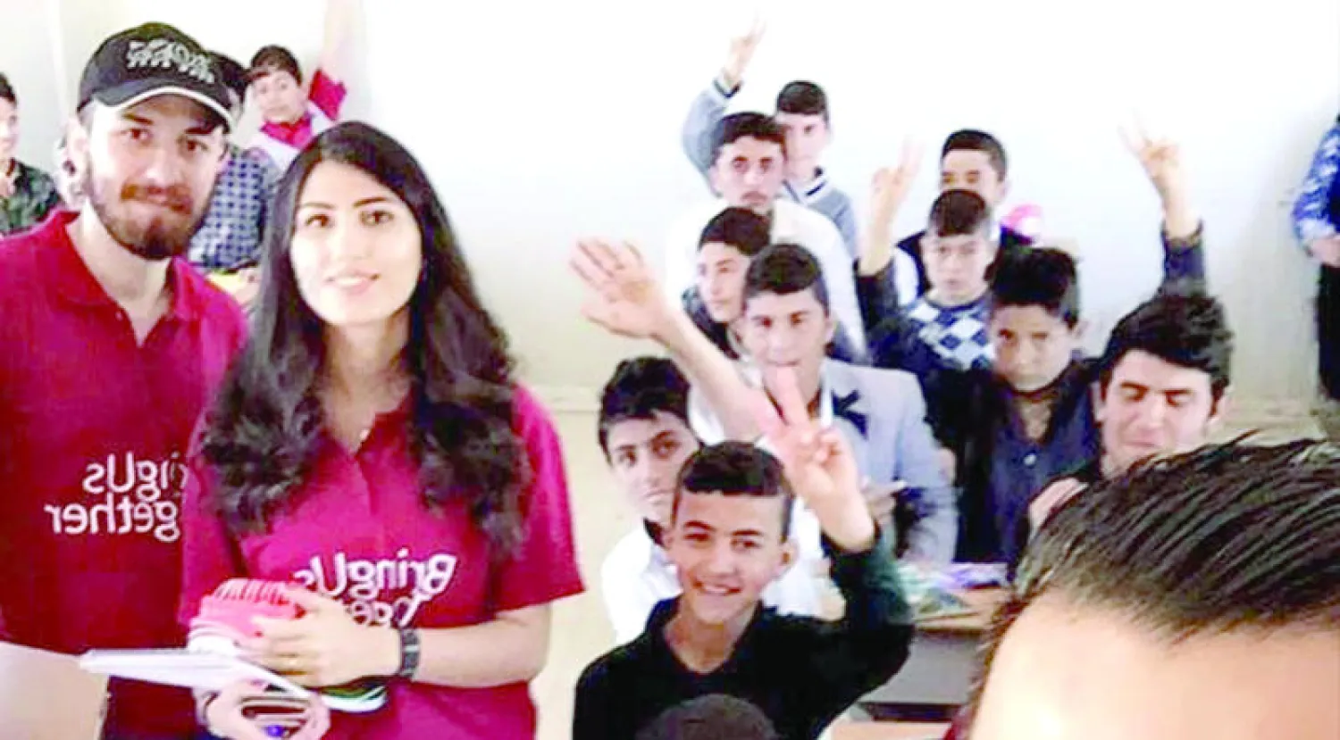 جانب من زيارة وفد الجامعة الأميركية في كردستان لمخيم اللاجئين في دهوك