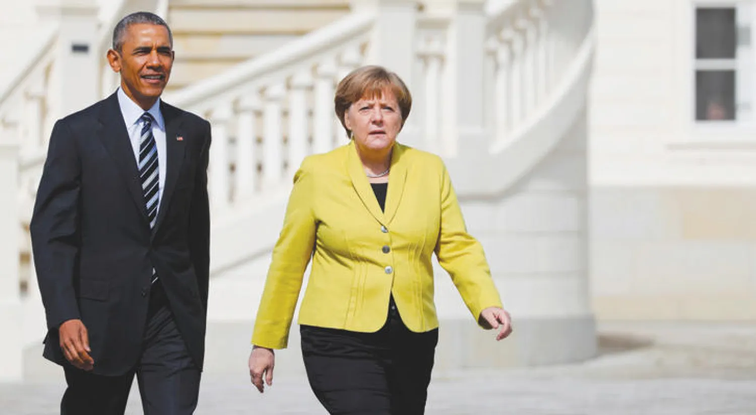 المستشارة الألمانية أنجيلا ميركل والرئيس الأميركي باراك أوباما بعد وصوله إلى هانوفر أمس (رويترز)
