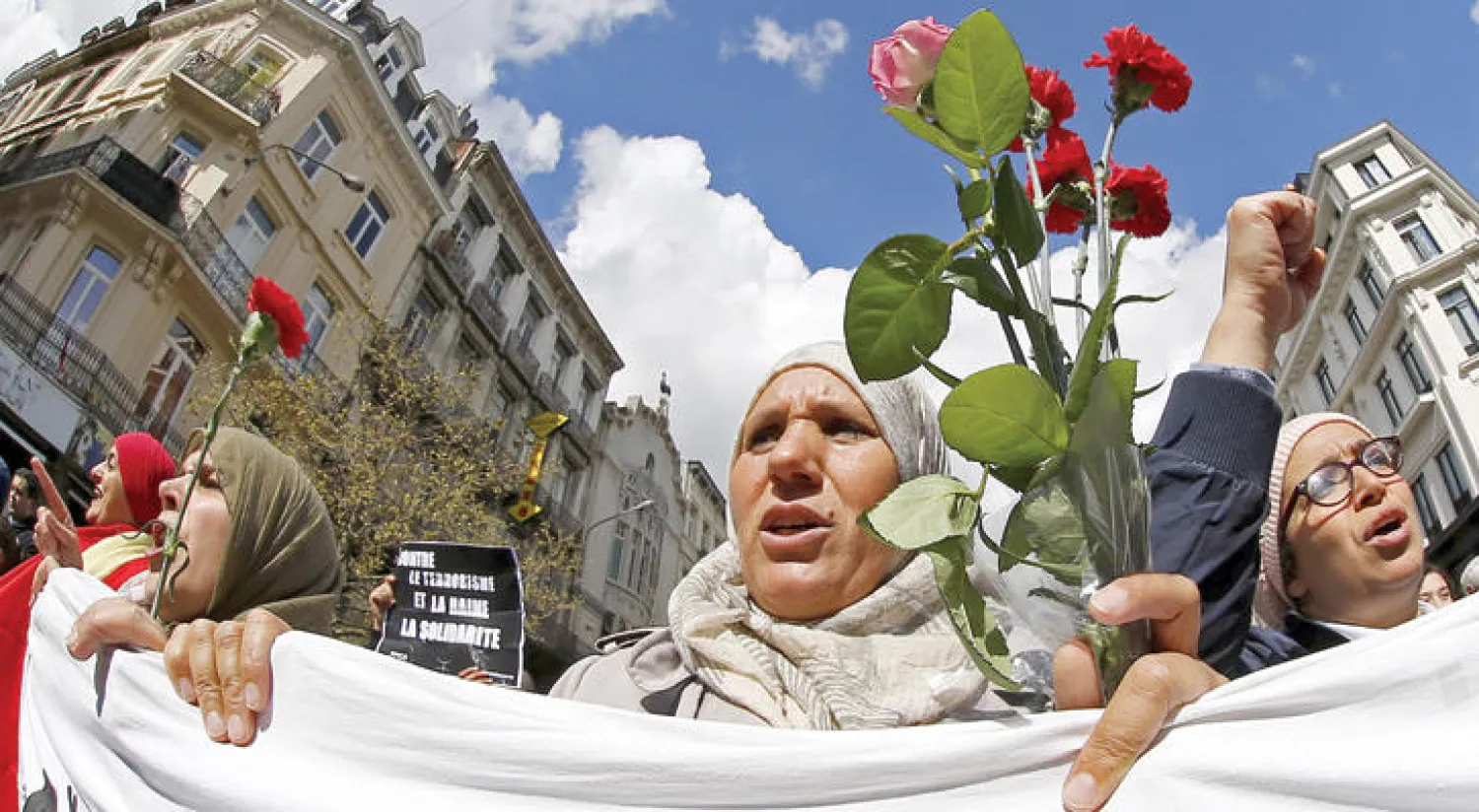 مسيرة ضد التطرف في ذكرى هجمات مارس في بروكسل شارك فيها عدد كبير من أبناء الجالية المسلمة في العاصمة البلجيكية أمس (رويترز)