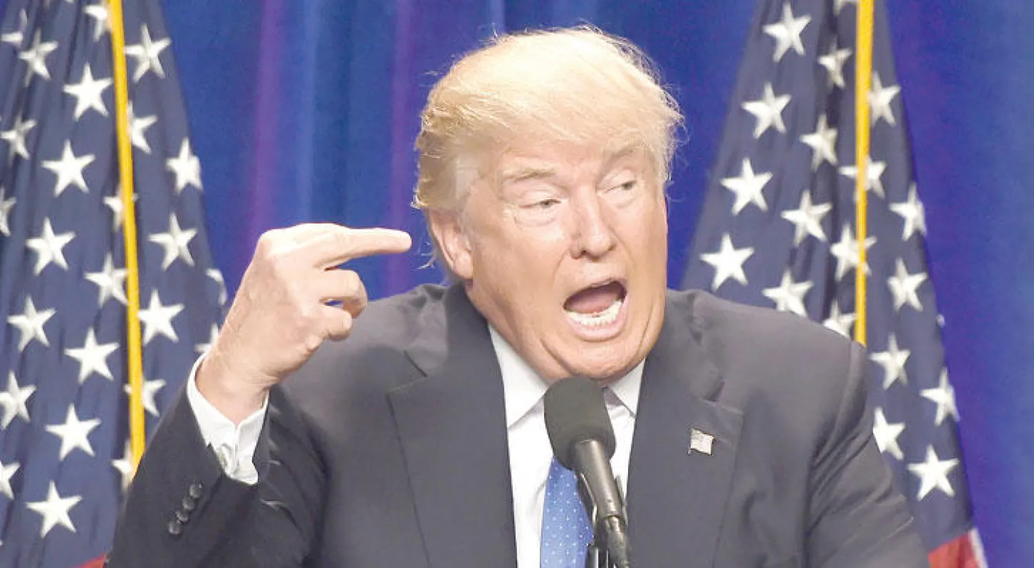 المرشح الجمهوري للانتخابات الرئاسية دونالد ترامب يتحدث عن برنامجه الانتخابي لمكافحة الارهاب أول من أمس في نيو هامبشير (أ.ف.ب)