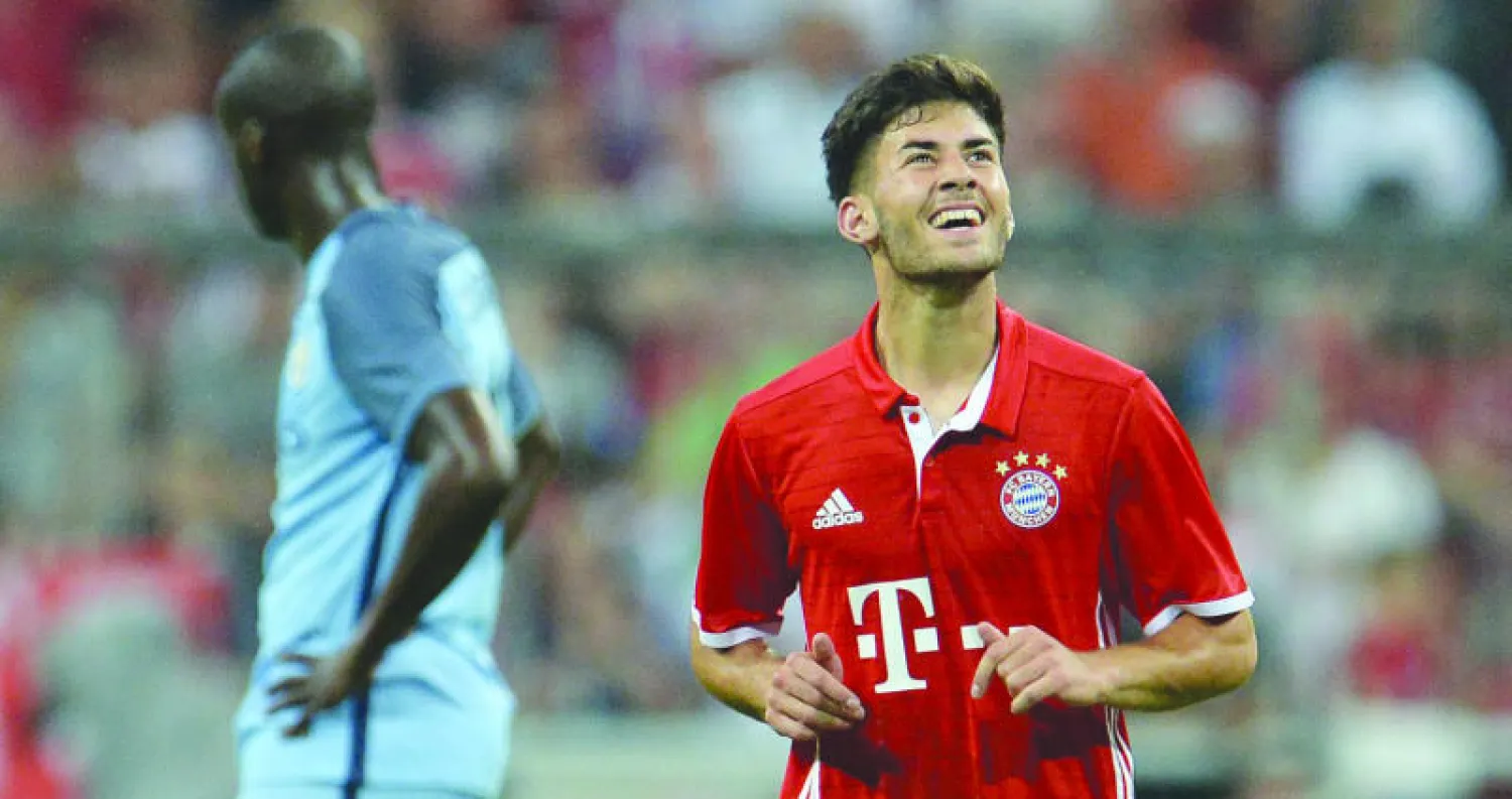 اوزتورك لاعب البايرن يحتفل بهدفه في مانشستر سيتي (ا.ب.ا)