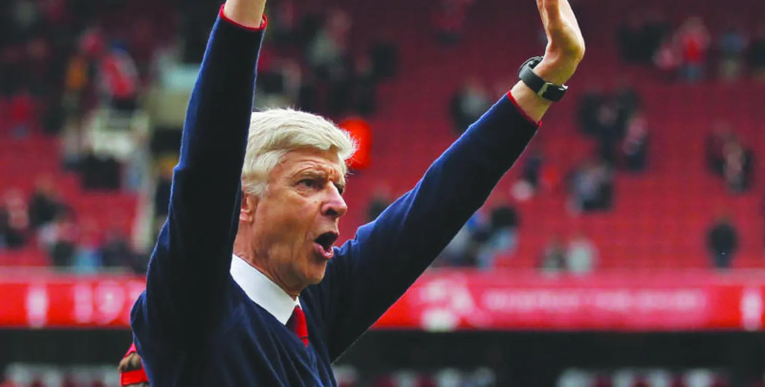 فينغر يتطلع للموسم الجديد وسط ريبة من المنافسين (أ.ف.ب)