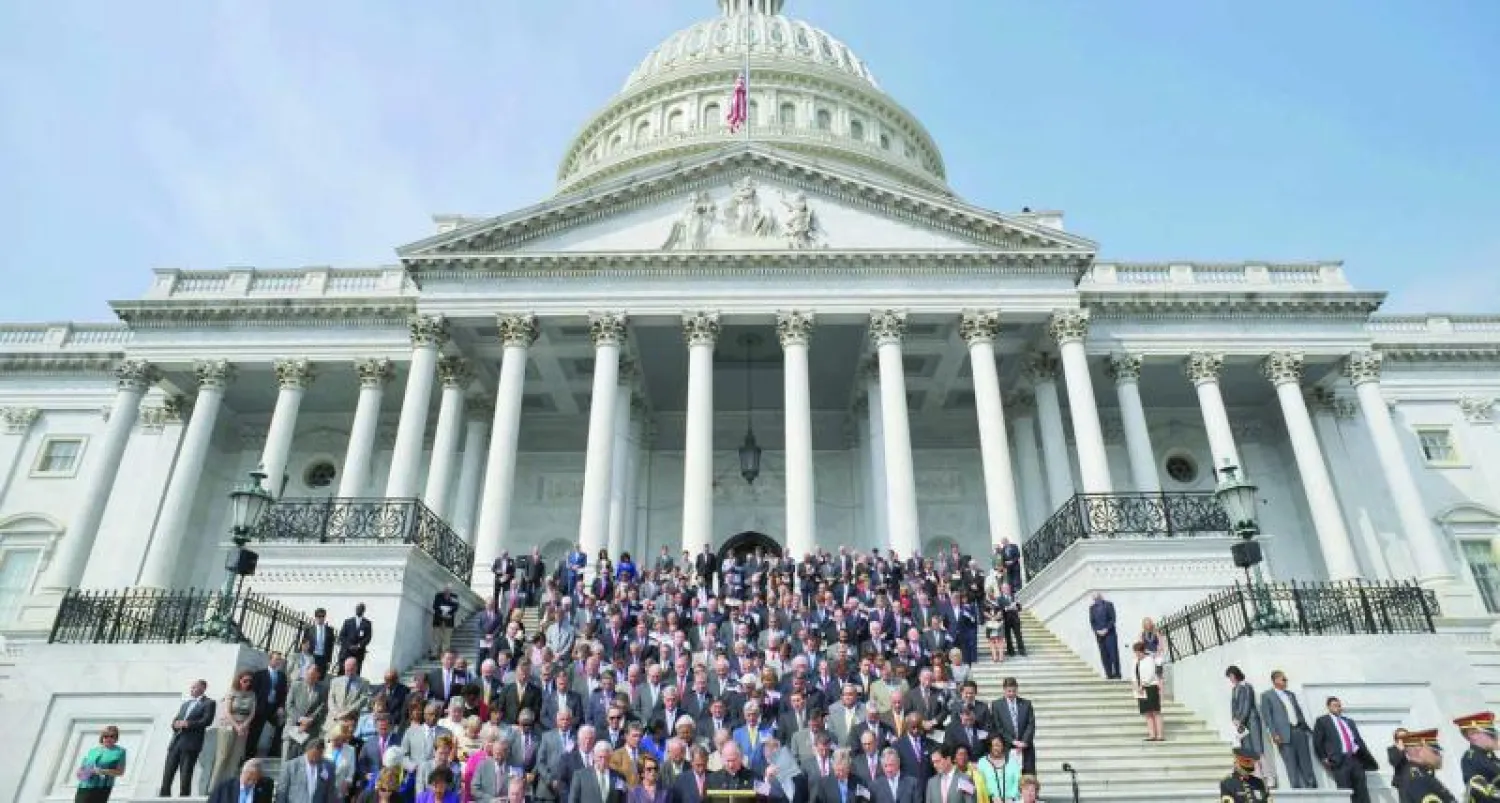 أعضاء الكونغرس الأميركي أمام مبنى الكابيتول هول في مناسبة سابقة للترحم على أرواح ضحايا 11 سبتمبر (أ.ف.ب)