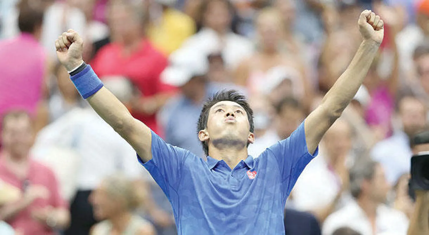 نيشيكوري يحتفل بانتصاره على موراي (رويترز)