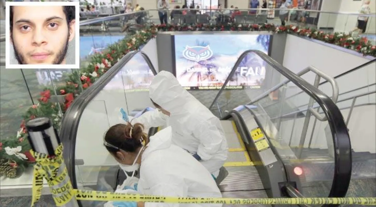 استيبان سانتياغو مهاجم مطار فورت لاديرديل بميامي في ولاية فلوريدا («الشرق الأوسط») - رجال البحث الجنائي يجمعون الأدلة الجنائية من مدخل قاعة استلام الحقائب في مطار فورت لودرديل بميامي في ولاية فلوريدا  (أ.ب)