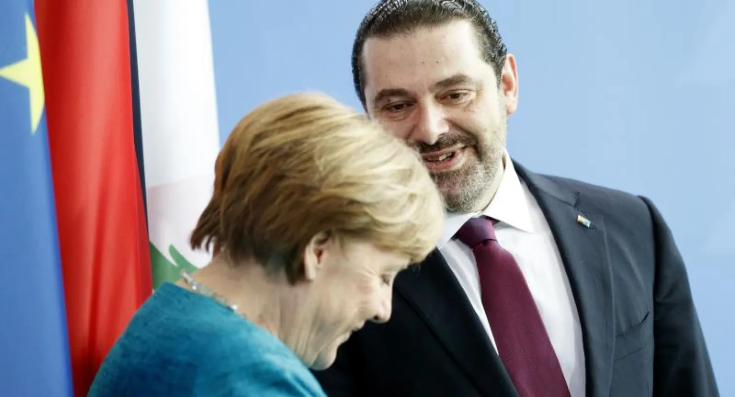 مؤتمر صحافي مشترك بين ميركل والحريري (إ.ب.أ)