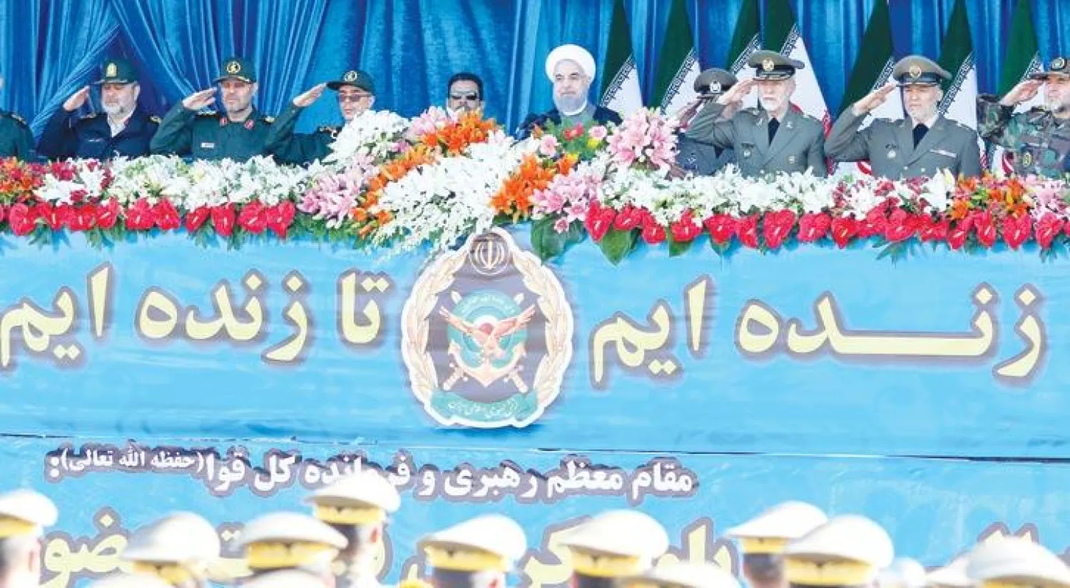 روحاني لدى حضوره عرضا عسكريا بمناسبة يوم الجيش الإيراني أمس (أ.ف.ب)