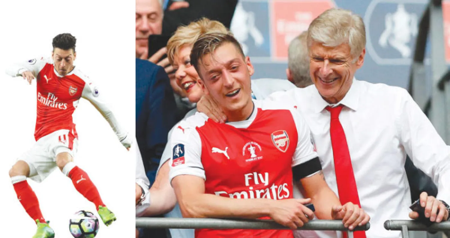 مماطلة أوزيل في التمديد... هل تتسبب في إفساد علاقته بفينغر؟ (أ.ف.ب)  -  مستقبل أوزيل مع آرسنال ما زال غامضاً (أ.ف.ب)