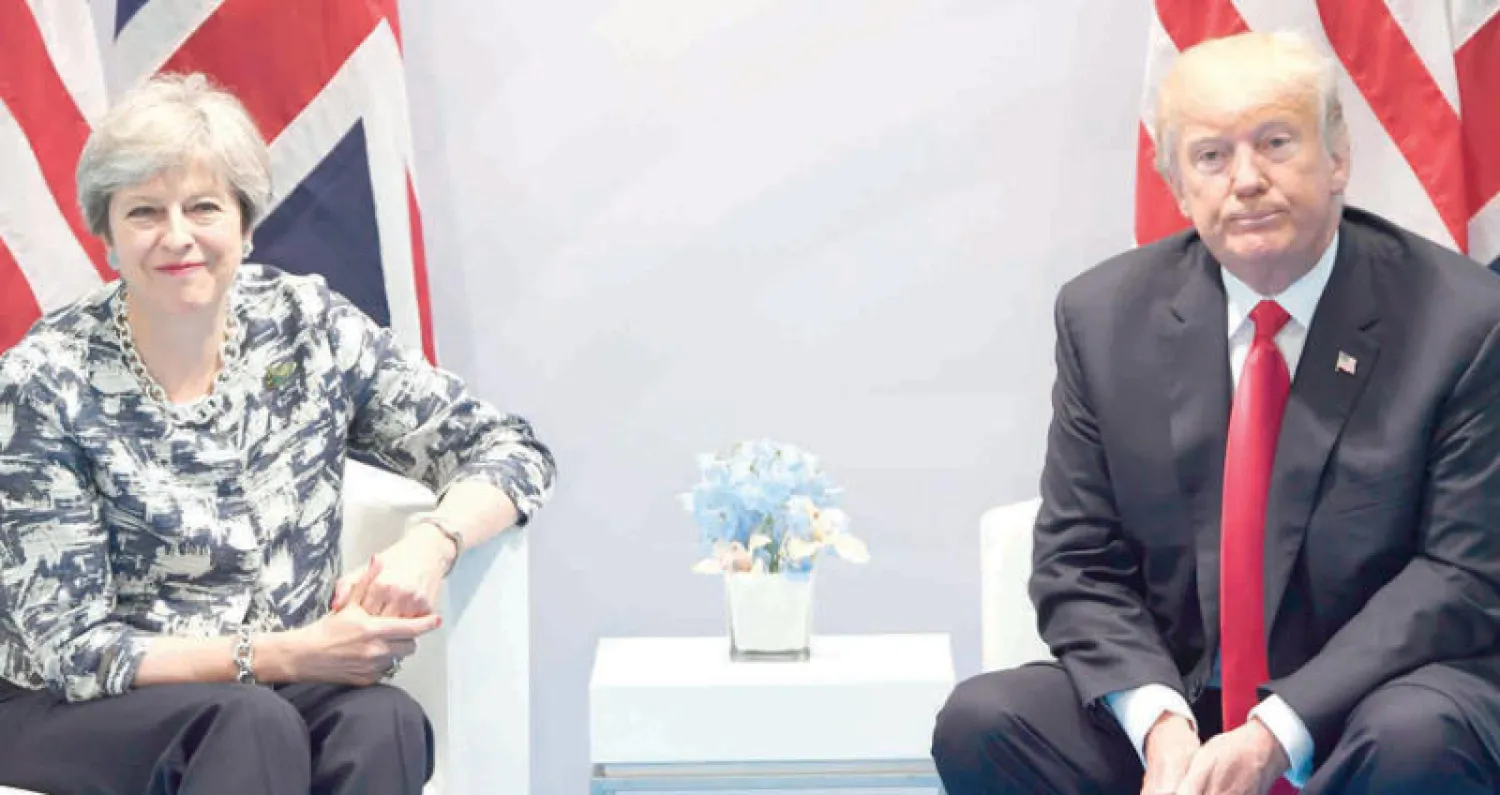 ترمب وماي (أ.ف.ب)