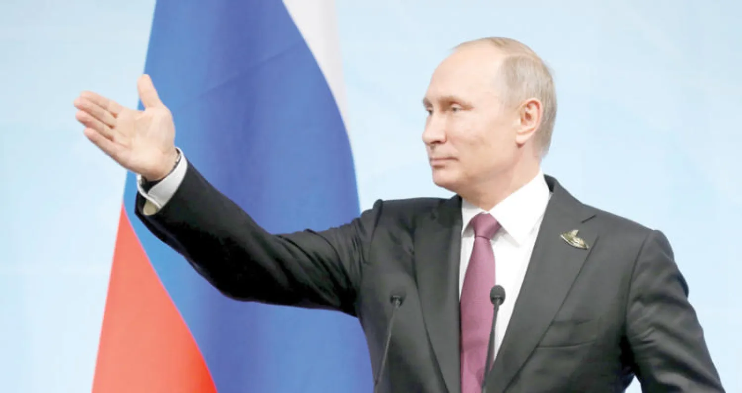 بوتين خلال المؤتمر الصحافي في هامبورغ أمس (إ.ب.أ)