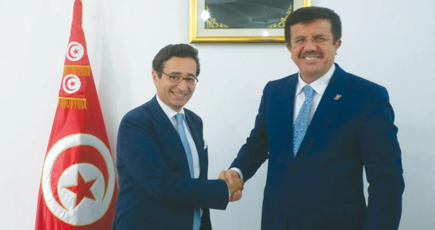 وزير الاقتصاد التركي نهاد زيبكي مع وزير التنمية والاستثمار التونسي فاضل عبد الكافي خلال أعمال مجلس الشراكة التونسي - التركي في تونس (غيتي)