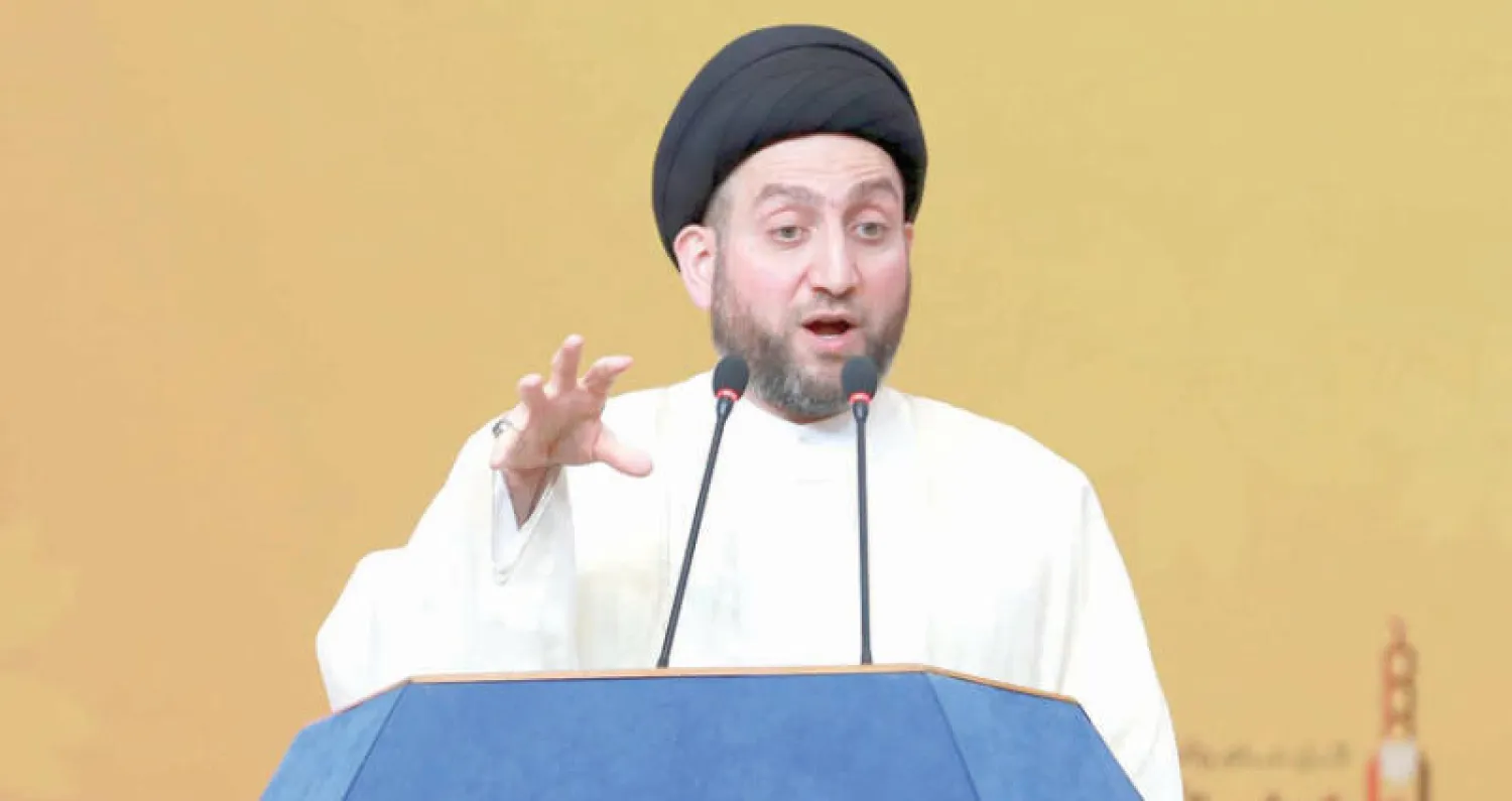 صورة أرشيفية لعمار الحكيم يخطب لمؤيديه في صلاة عيد الفطر في مقر حزبه ببغداد (أ.ب)