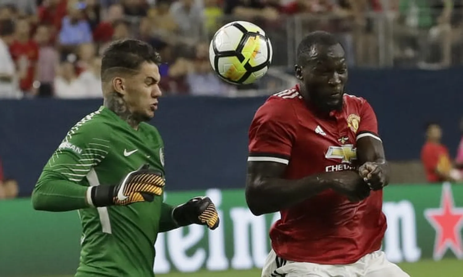  Manchester City’s Ederson, left, comes off his line during a friendly against Manchester United but Romelu Lukaku heads past him before scoring. Photograph: David J. Phillip/AP 
