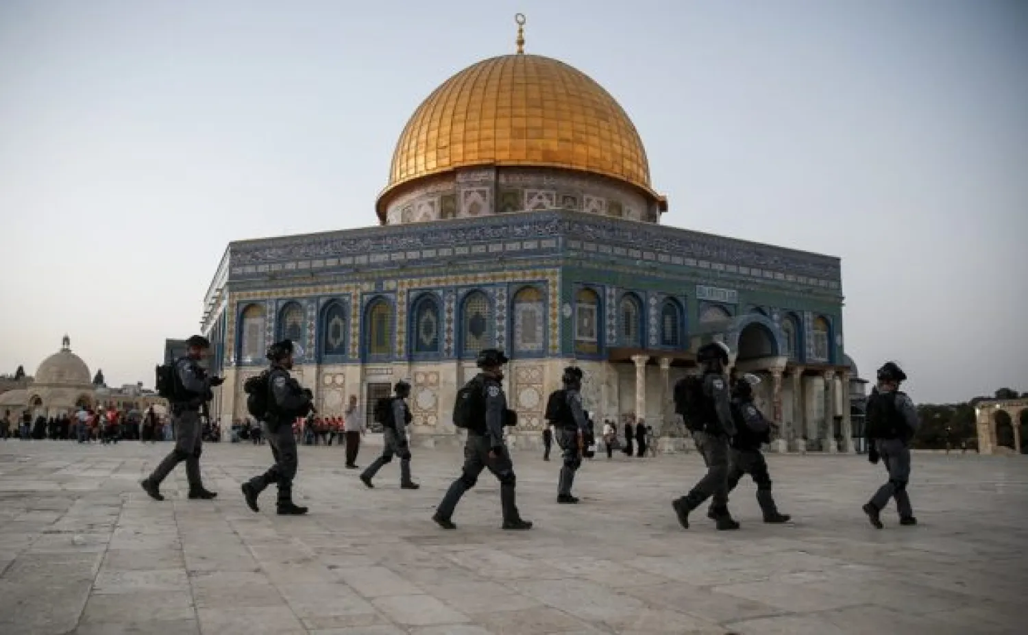 Members of the Israeli security forces walk past the al-Aqsa Compound in the Old City of Jerusalem on July 27, 2017. (AFP)