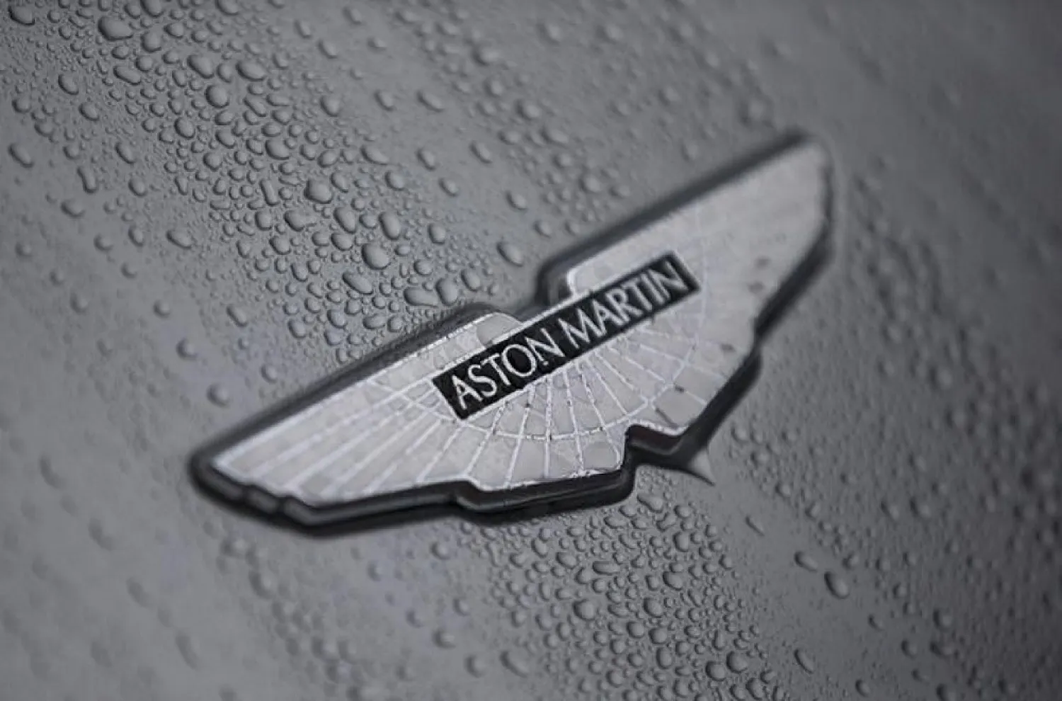 The badge of an Aston Martin DB10 is displayed at a UK Trade and Investment event in London, Britain. (Reuters)