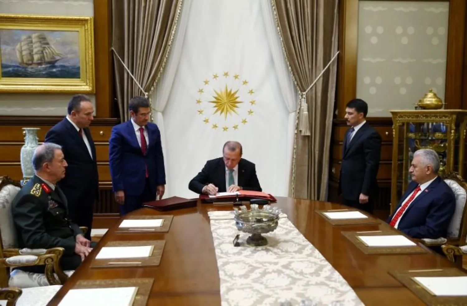 Turkish President Recep Tayyip Erdogan signs to approve decisions of the Supreme Military Council at the Presidential Palace in Ankara, Turkey, August 2, 2017. (Presidential Palace handout)
