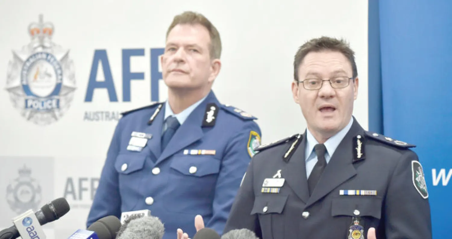 نائب مفوض الشرطة الأسترالية مايكل فيلان في مؤتمره الصحافي بسيدني أمس (أ.ف.ب)