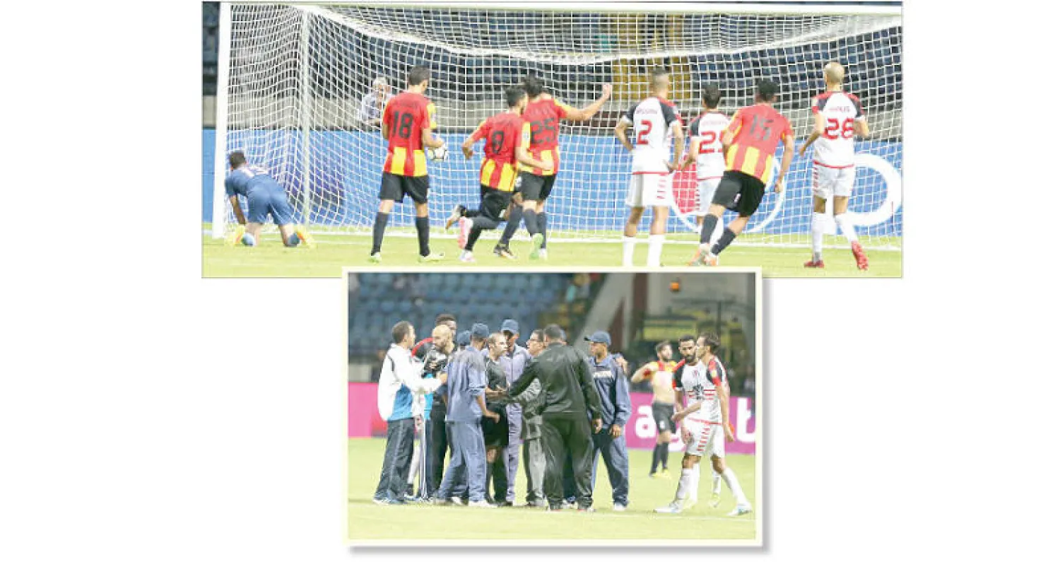 فرحة كبيرة للاعبي الترجي التونسي عقب الفوز على الفريق المغربي   (تصوير: أحمد يسري) - جانب من الحماية الأمنية للحكم السعودي تركي الخضير  عقب مباراة الترجي التونسي والفتح الرباطي المغربي (تصوير: أحمد يسري)