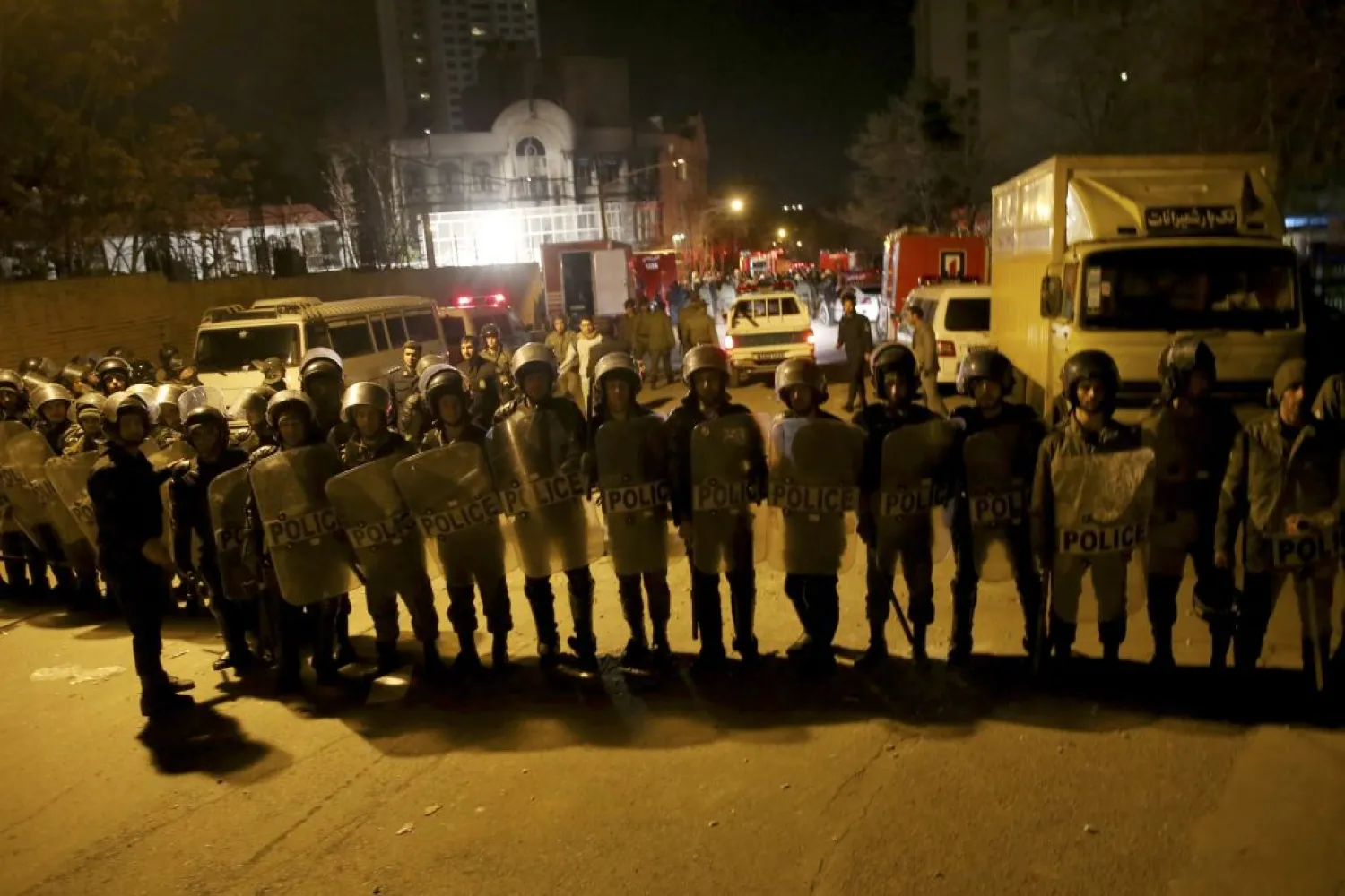 Iranian security stand guard to protect Saudi Arabia's embassy in Tehran. (AP)
