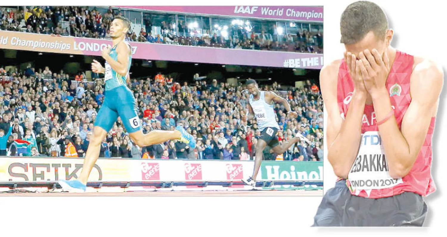 المغربي سفيان البقالي يبكي فرحا بعد فوزه  بالفضية (رويترز) - الجنوب أفريقي فان نيكرك انفرد بالمقدمة ليحرز ذهبية سباق 400 متر بسهولة (رويترز)