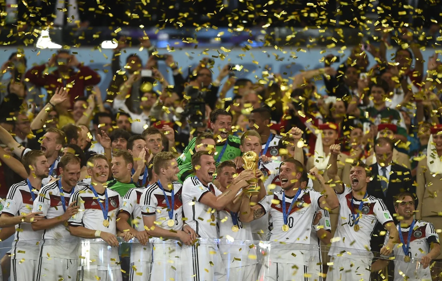 Germany's players hold up the World Cup trophy as they celebrate after winning the 2014 FIFA World Cup. (AFP)