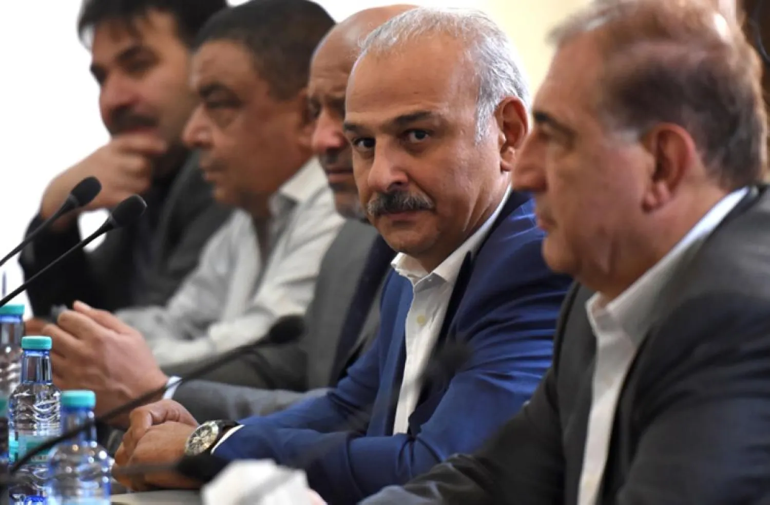 Syrian actor and opposition member Jamal Suleiman and former deputy PM Qadri Jamil, member of Syria's regime-tolerated opposition, are seen during a meeting in Riyadh. (AFP)