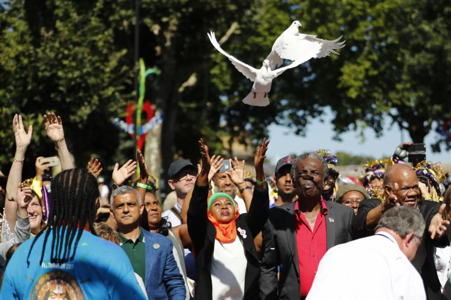 Doves are released before the Notting Hill Carnival to acknowledge the lives lost in the Grenfell Tower tragedy. (AFP)