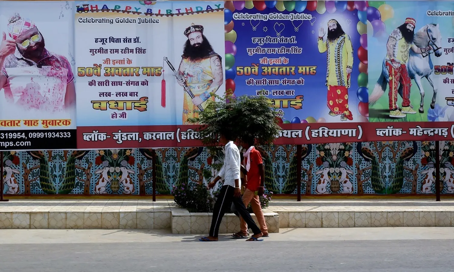 Followers of controversial Indian guru Ram Rahim Singh walk outside the Dera Sacha Sauda ashram in Sirsa. (AFP)